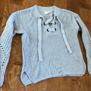 A knitted grey sweater